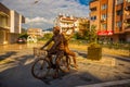 MARMARIS, TURKEY: A modern monument of a guy and a girl riding a bicycle on the street in Marmaris.