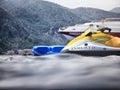 Marmaris, Turkey - May 21, 2018: Sea surface, waves, mountain coast in the distance and ship. Sshooting from water