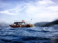 Marmaris, Turkey - May 21, 2018: Sea surface, waves, mountain coast in the distance and ship. Sshooting from water