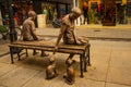 MARMARIS, TURKEY: A modern monument of a girl and a boy on a bench on the street in Marmaris.