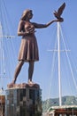 MARMARIS, TURKEY - OCTOBER 19, 2013: Girl with a pigeon starue