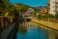 MARMARIS, TURKEY: Sculpture of a Frog, a Fish, a Seahorse on the street by the canal in Marmaris on a sunny day.