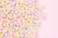 Marmellow air marshmallow close-up on a pink background, pastel colors, light dessert, place for text Royalty Free Stock Photo