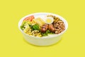 Marmita or marmitex, Brazilian home-delivered lunch meal, with rice, sausage, farofa and salad, beans, copy space, yellow Royalty Free Stock Photo