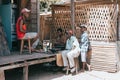 Malagasy men repairing speakers, Maroantsetra Madagascar
