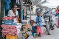 Malagasy woman with children on Madagascar marketplace