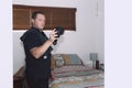 Maroochydore, Australia - March 5, 2020. Young Male Pest Control Worker checking apartment with FLIR E6 thermal imaging