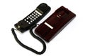 A maroon black colored home analogue line phone