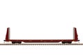 A Maroon Bulkhead Flat Car On Track