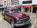 Maroon Chevrolet De Luxe coupe parked in Lima