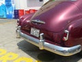 Maroon Chevrolet DeLuxe coupe parked in Lima