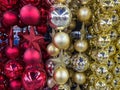 Maroon christmas tree balls and red or dark pink star ornaments hung in a christmas decoration store Royalty Free Stock Photo