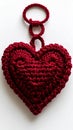 Maroon Knitted Heart Ornament with Loop Against White Background Royalty Free Stock Photo