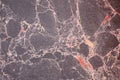 Maroon marble, natural stone texture with beige veins. Background. Close up shot Royalty Free Stock Photo