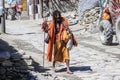 A local crazy saint with a beard and dreadlocks in traditional Sikh clothes. Brahma walks along the village street and begs with a