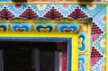 MARPHA, NEPAL - MAY 2015: Detail of wood carving on Nepalese Buddhist monastery entrance door