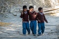 Three Schoolboys Walking to School