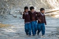 Three Schoolboys Walking to School