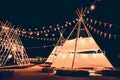 The marquee decorated with flags, decorated in a party during the night