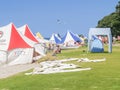 Marquees and people erected at beach event Royalty Free Stock Photo