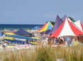 Marquees and people erected at beach event Royalty Free Stock Photo