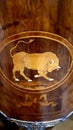 Marquetry image of a bull on commode in the furniture collection in the Lady Lever Art Gallery in Port Sunlight in Merseyside