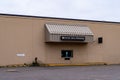 An abandoned drive-thru pharmacy from a closed Shopko store