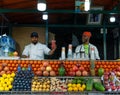 Marrakech, Morocco - 15 JAN 2019: Two happy arabic Fruit fresh juice sellers on Jemma El Fna square in Marrakesh Royalty Free Stock Photo