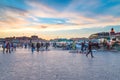 Sunset at Jemaa El-Fna with undefined people.