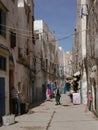 Marrakech, Morocco-November 13, 2019: Moroccan city landscape. Ancient narrow streets of old buildings. Poor neighborhood with Royalty Free Stock Photo