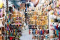 Marrakech, Morocco, september 16, 2019: Shoes hanging in an oriental market with people walking through Royalty Free Stock Photo