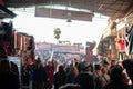 Marrakesh, Morocco - January 2019: Crowd of people strolling at souk bazaar big street market across the famous Jemaa el