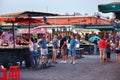 MARRAKESH, MOROCCO - JUNE 03, 2017: Evening in the famous Jemaa el-Fnaa square also Jemaa el-Fna, Djema el-Fna, or Djemaa el-Fnaa Royalty Free Stock Photo