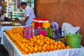 MARRAKESH, MOROCCO - JUNE 04, 2017: Sale of fresh orange juice in the medina of Marrakesh on a sunny day