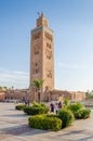 Marrakesh, Morocco - September 05 2013: Koutoubia Mosque with local people and sqaure on sunny day Royalty Free Stock Photo