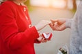 Marriage proposal. Man hold engagement ring at red box in his ha Royalty Free Stock Photo