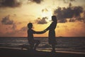 Marriage proposal at sunset beach Royalty Free Stock Photo