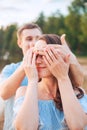 Marriage proposal on sunset . young man makes a proposal of betrothal to his girlfriend on the beach Royalty Free Stock Photo