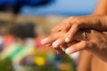 Marriage rings on hands in light