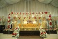 Marriage stage red and white flowers with golden sofa