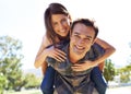 Marriage is still so much fun. a young couple being playful in the park. Royalty Free Stock Photo