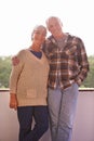 A marriage theyre proud of. A portrait of a happy senior couple standing on their balcony at home. Royalty Free Stock Photo