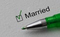 Married - checkbox with a cross on white paper with pen. Checklist concept.