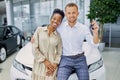 Married couple in cars showroom
