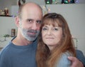 A Married Couple with Christmas Lights Behind Royalty Free Stock Photo