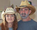 A Married Couple with Christmas Lights Behind Royalty Free Stock Photo