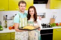 Married couple cooking apple pie at the kitchen at home Royalty Free Stock Photo