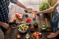 Married couple cooking together dinner vegetables salad in home Royalty Free Stock Photo