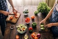 Married couple cooking together dinner vegetables salad. Healthy Royalty Free Stock Photo