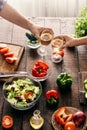 Married couple cooking together dinner vegetables salad in home Royalty Free Stock Photo